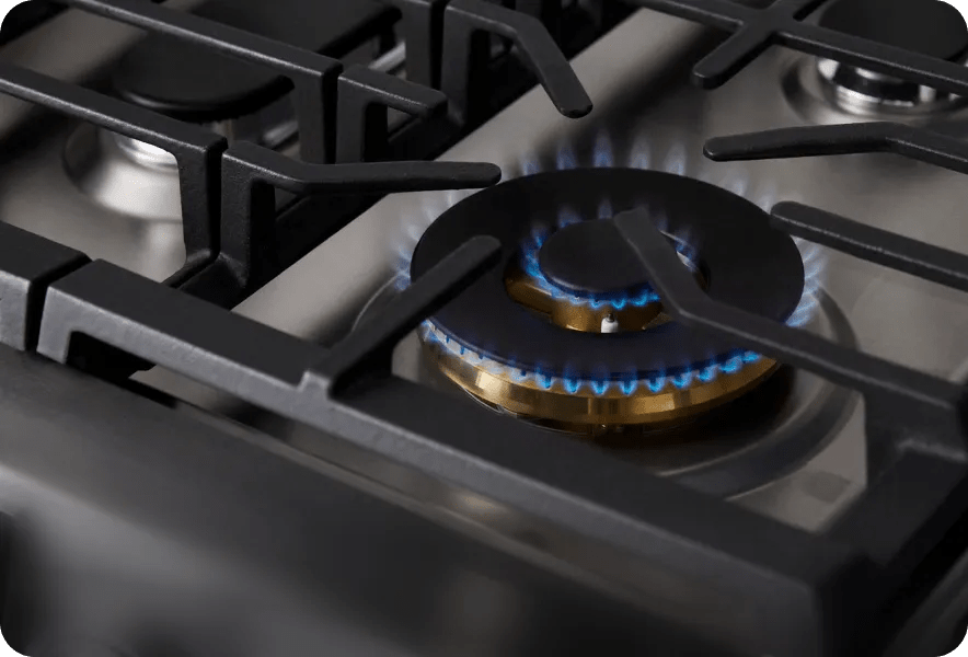 LG SIGNATURE Iconic Collection range cooktop with UltraHeat Burners close-up, heavy-duty grates and precision gas control knobs.