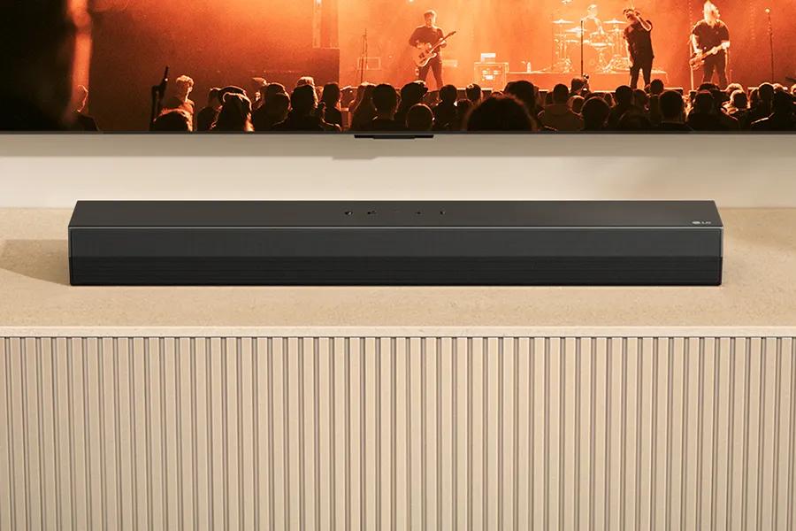 Image on the TV screen with soundbar nestled under the TV