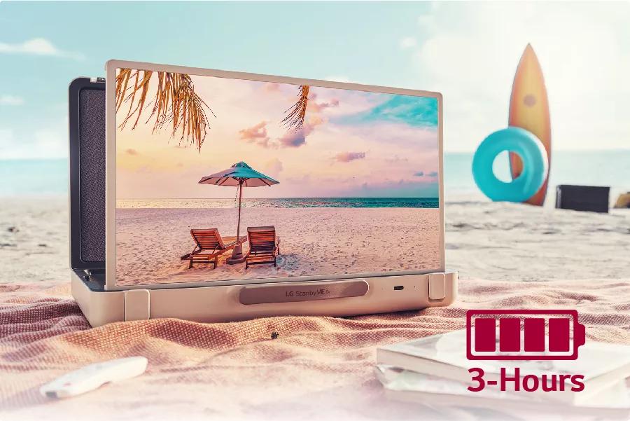 The TV is placed on a beach blanket at the beach. Text: 3 hours.