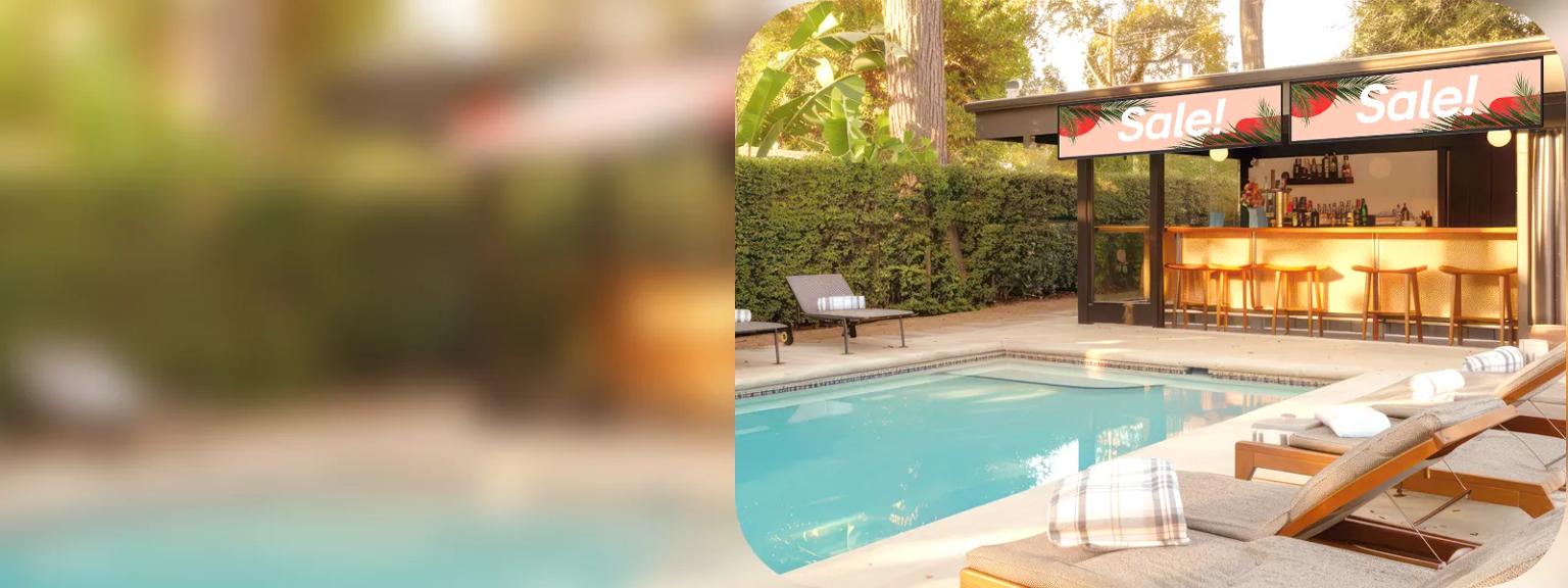An upscale resort pool area. LG stretch signage over a tiki bar advertises the current LG promotion, with Sale in white on a pink background.