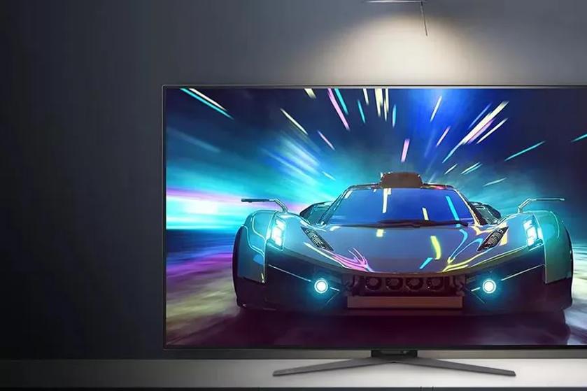 An ultragear monitor displaying a futuristic, high-speed car with dynamic light streaks.