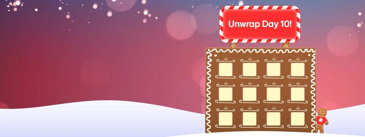 A gingerbread office in the snow. A gingerbread man with an LG sweater is next to it. DVLED signage framed with peppermint on top of the office reads: Unwrap Day 10!