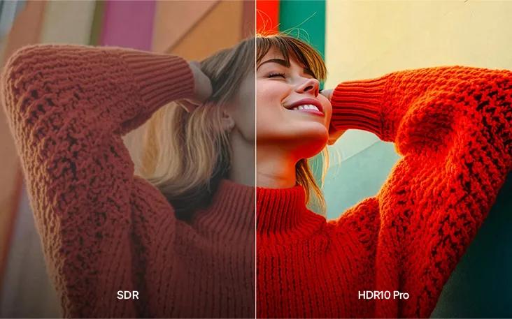 LG TV with HDR10 Pro optimizes picture quality as a split display compares SDR and HDR10 Pro, showing a woman in a red knit sweater with brighter highlights, richer skin tones, and more vivid fabric texture for greater depth.