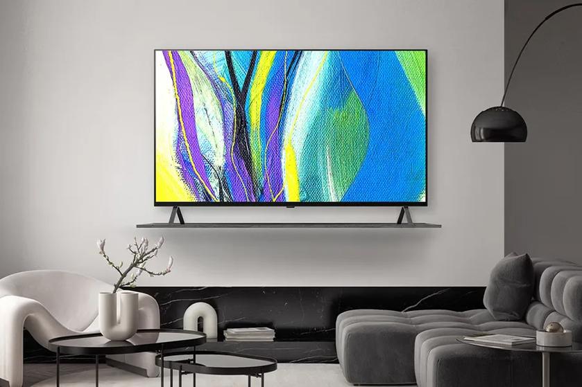 Hotel room with an OLED TV displaying modern art.