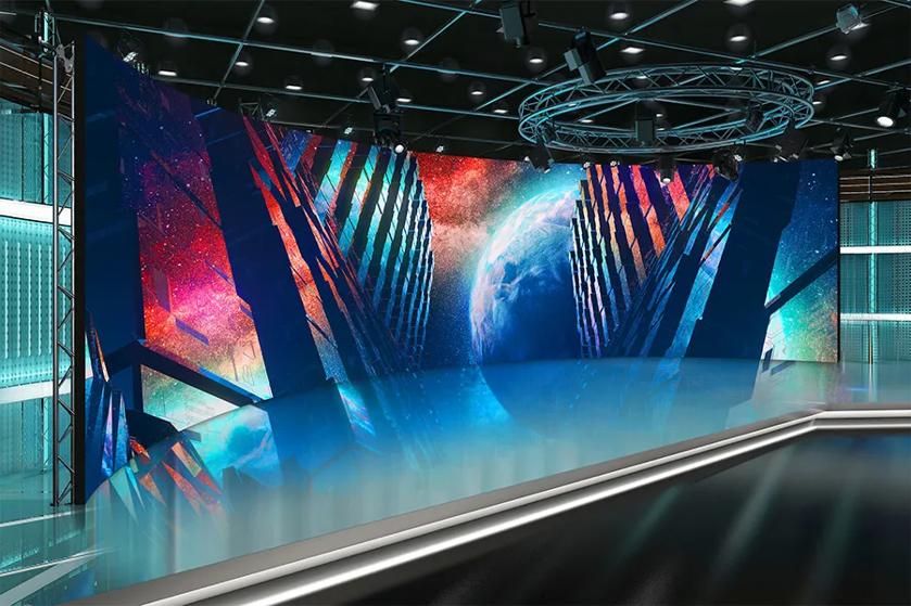 Futuristic digital display room with a curved screen showing vibrant, space-themed artwork.