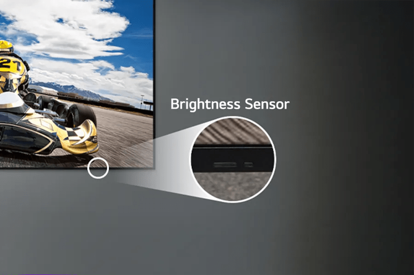"Digital display with go-kart racing scene and a close-up of a brightness sensor."