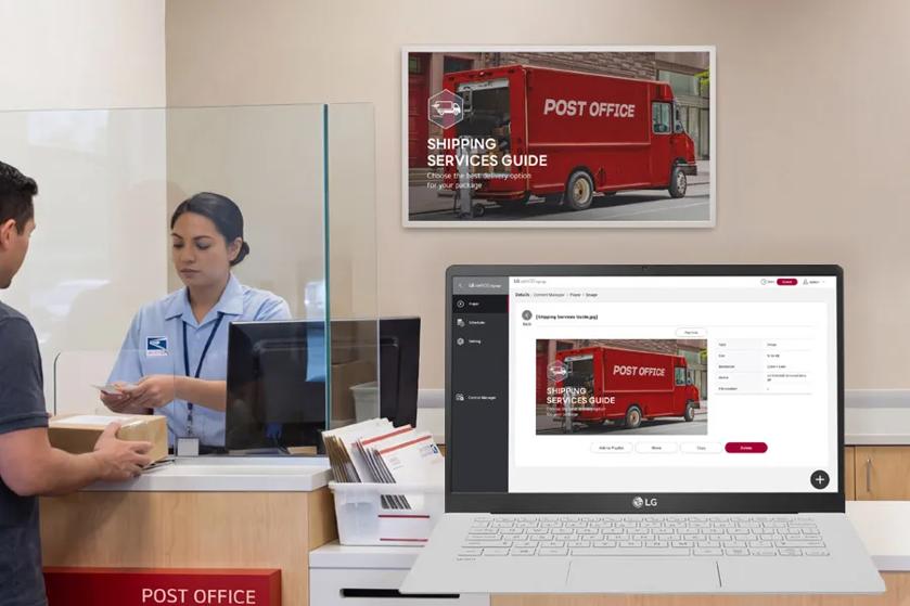 An LG e-paper display in a post office. A laptop overlaid on the scene shows the webOS device management capabilities. 