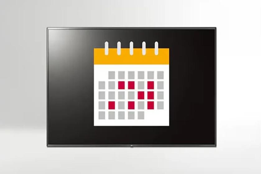 A flat-screen monitor showing a calendar icon with gray and red squares.