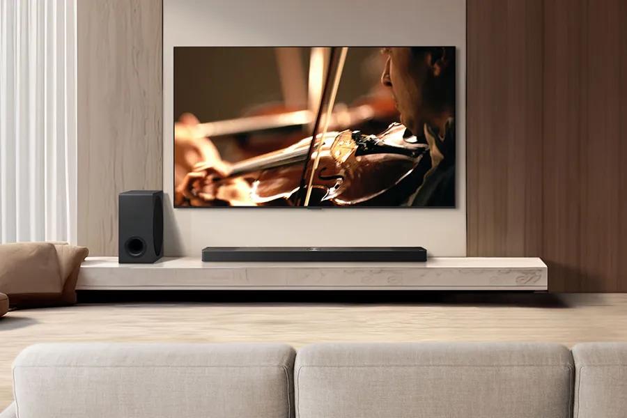 Living room showing a TV and soundbar with subwoofer