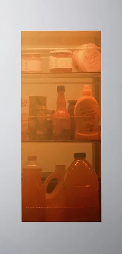 Interactive feature showing an InstaView panel on the left and a color-selection interface on the right. Users can choose from five LED lighting options: Emerald Green, Sapphire Blue, Amethyst Purple, Ruby Red, or Citrine Orange. When a color is selected, the name of that hue appears and the InstaView window reveals the inside of the fridge illuminated in that chosen color.