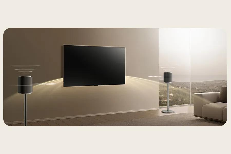 Image of an LG TV with sound waves pulsing from the LG Sound Suite M7 speakers, showing easy set up.