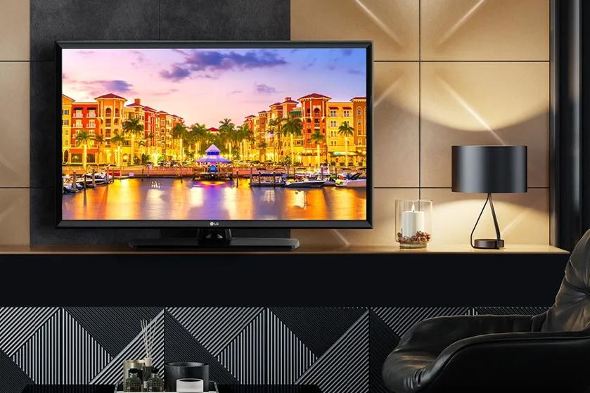 Hotel room with an LG TV displaying a vibrant, colorful city.