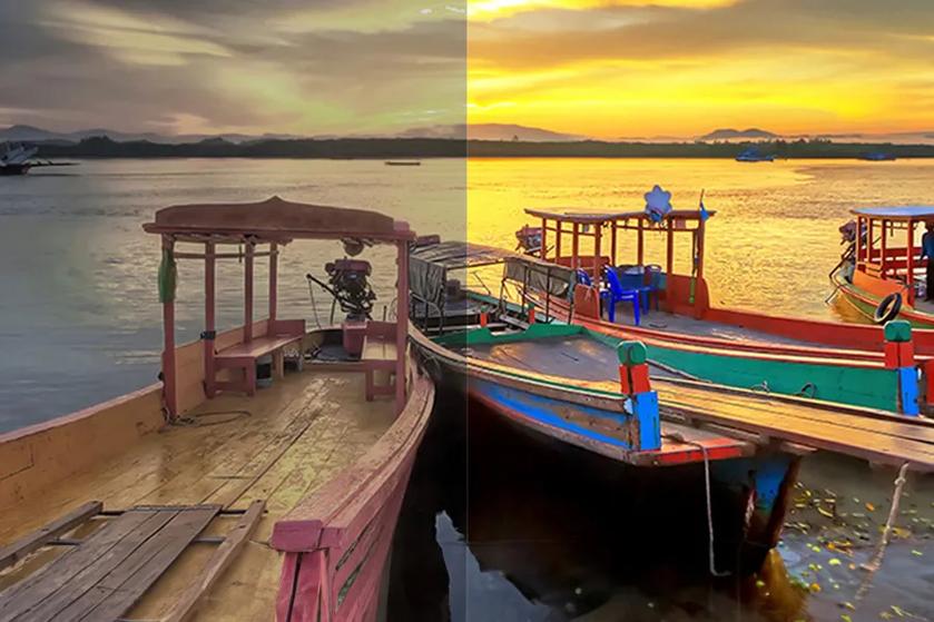 A split image of a wooden boat on a river, showing one side in muted colors and the other in vivid sunset hues.