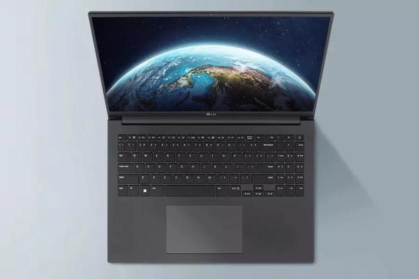 A gray, LG Ultra PC laptop sits open. The view is as if the viewer is standing  directly over the laptop. The screen shows an image of the hop half of earth.