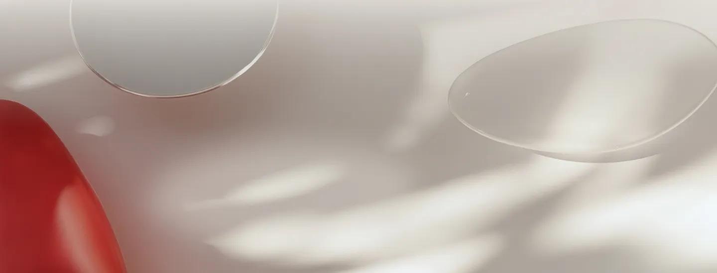 Abstract flowing red and white shapes with soft gradients and translucent white bubbles