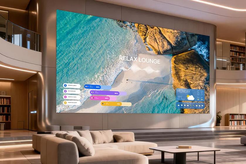 A modern room with a large digital screen displaying a beach scene labeled "RELAX LOUNGE."