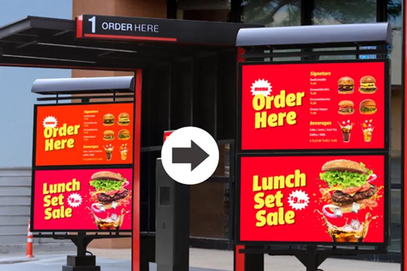 Fast-food drive-thru with red menu boards advertising burgers and drinks.