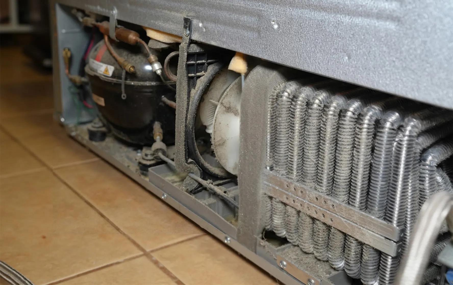 Refrigerator coils before and after cleaning - Before