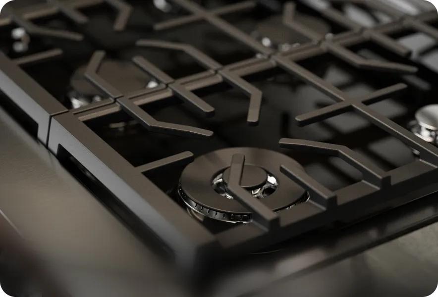 LG SIGNATURE Iconic Collection range cooktop with UltraHeat Burners close-up, heavy-duty grates and precision gas control knobs.