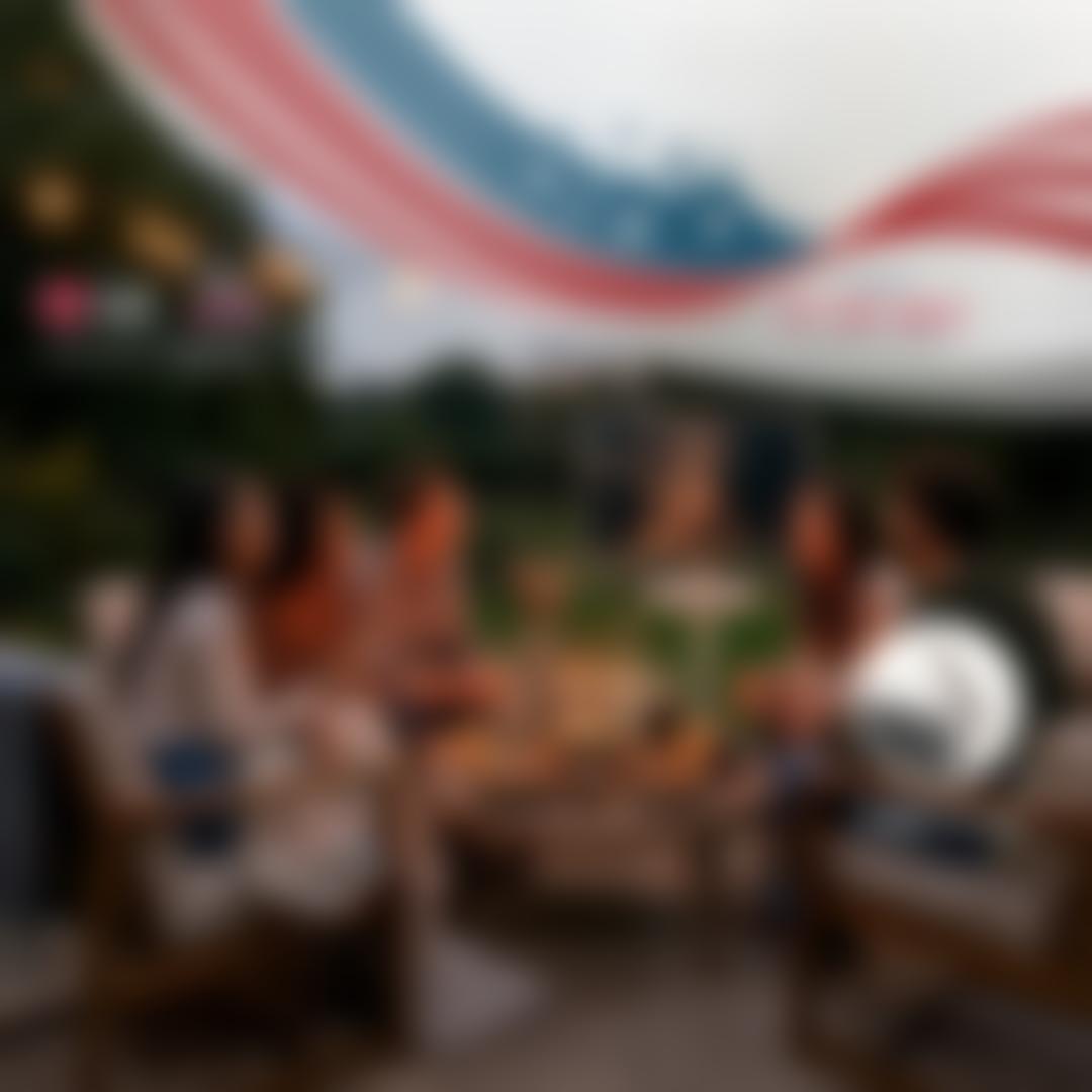 “4th of July Savings Event” title. “LG + America250: Proud Partner of America250” badge. AStanbyME 2 Smart Portable Touch Screen appears on a stars and stripes background. Text “Free Strap” appears beside it. 