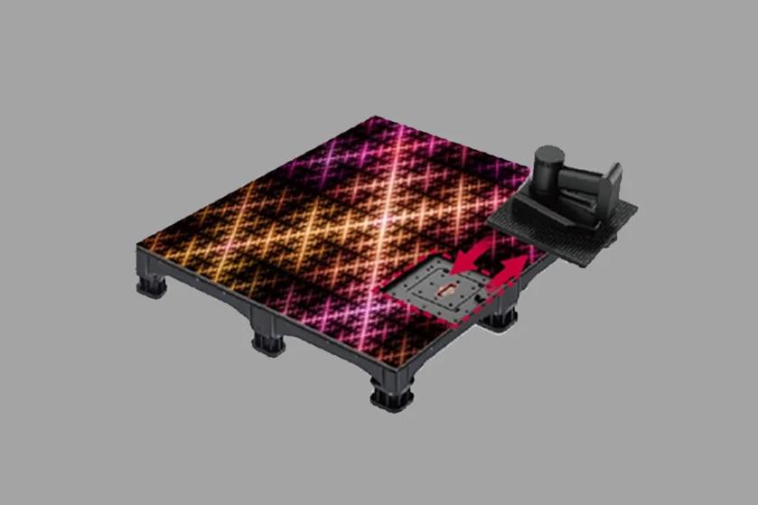 A platform with a colorful plaid pattern and a black component on top