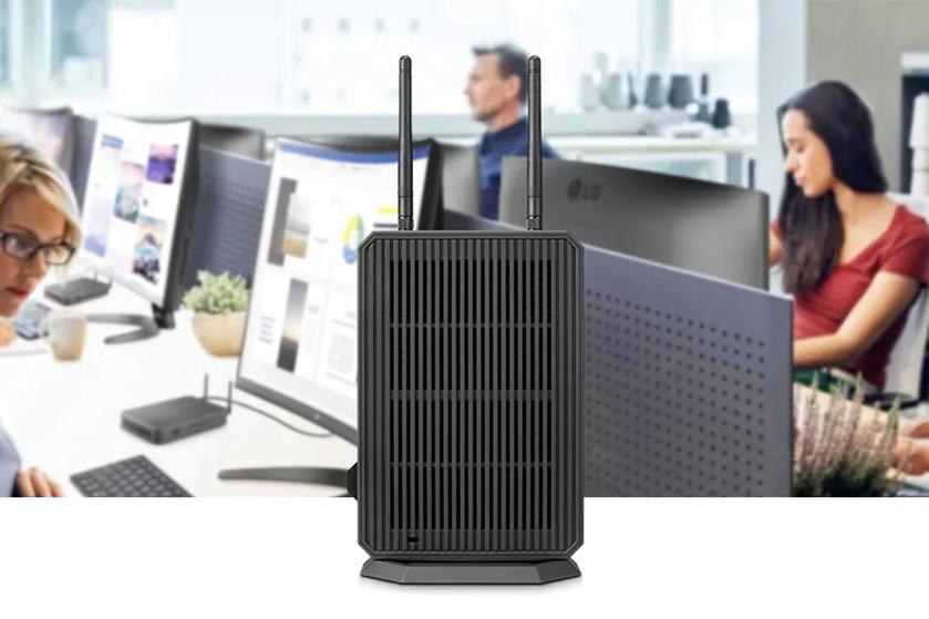 A busy office in the background, with an LG box type cloud client in the foreground.