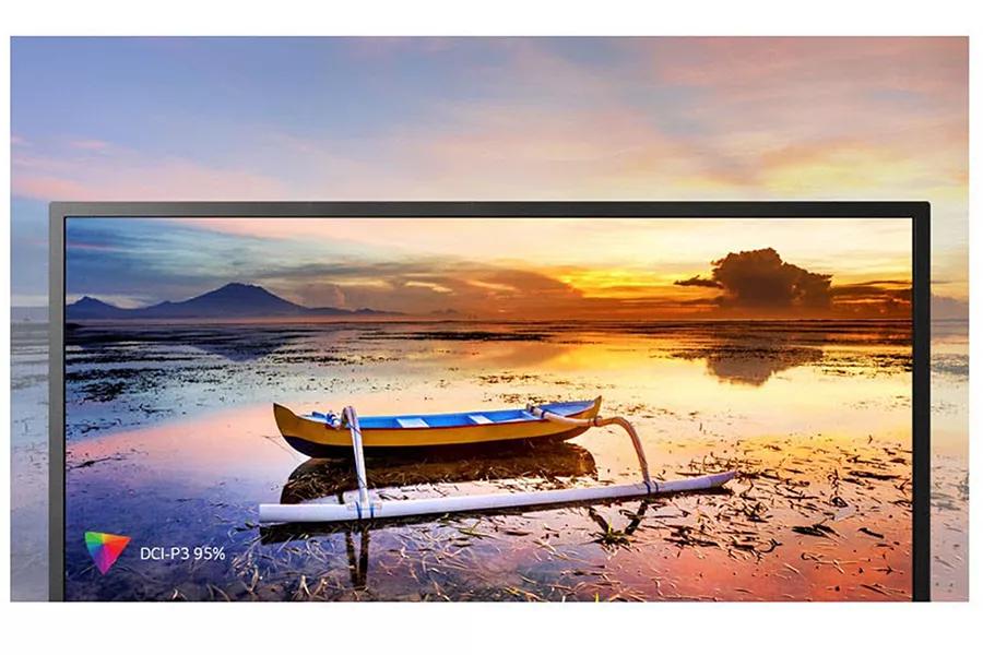 boat on a lake overlooking a colorful horizon