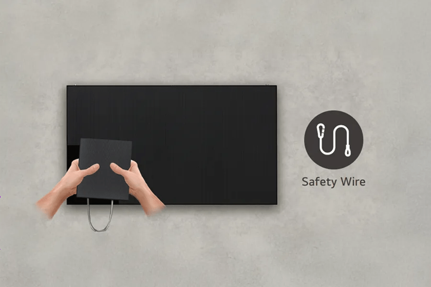 Hands holding a black panel with a safety wire icon and text on the right.