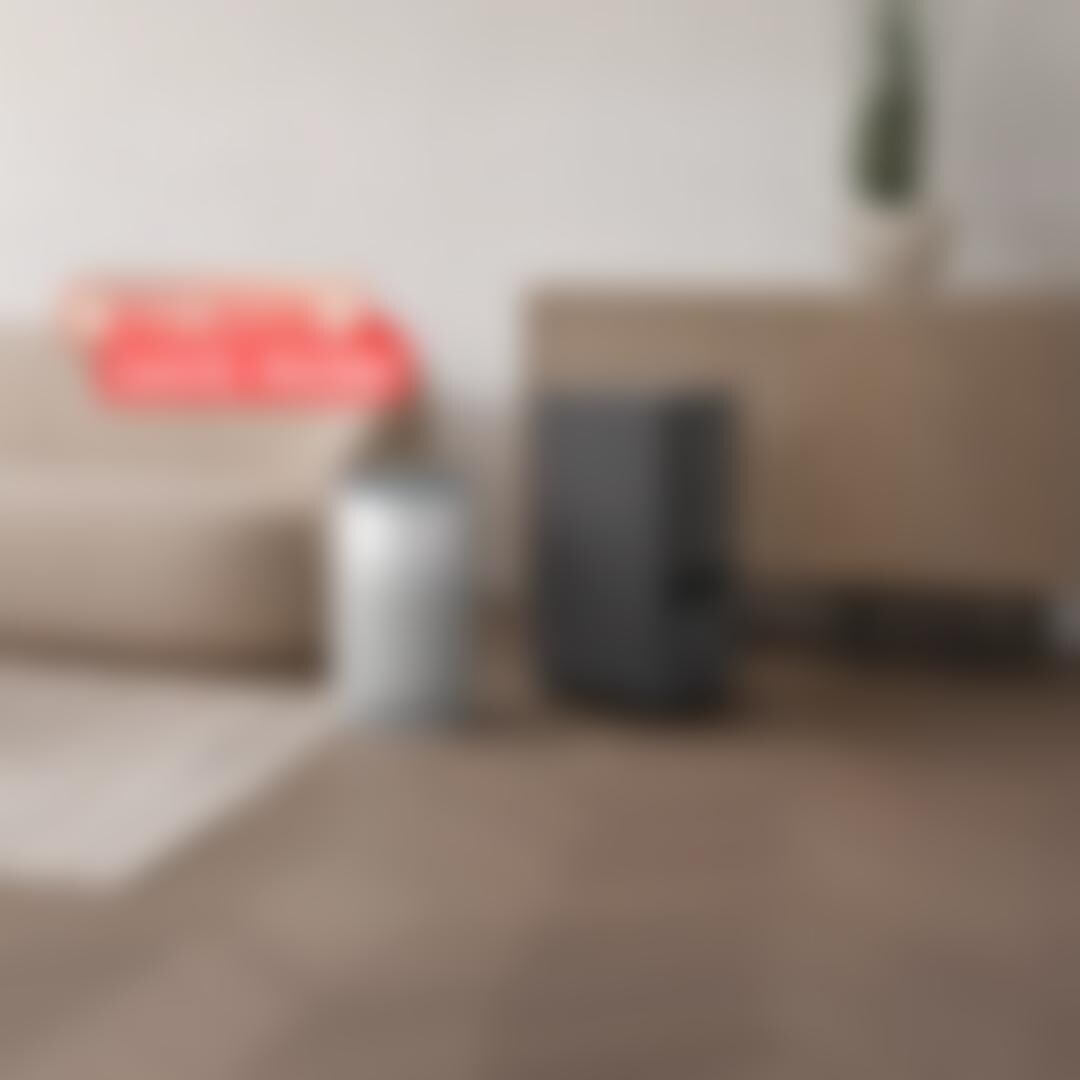 LG air purifier and LG dehumidifier side by side in a modern living room. “Buy More Save More” badge.