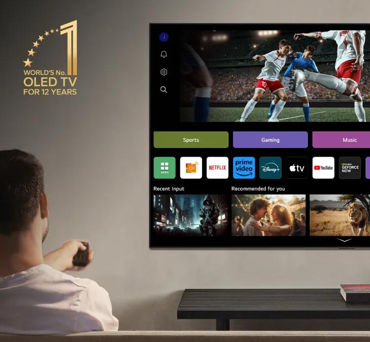 A man browses the webOS interface on an LG OLED evo using his Magic Remote. A gold icon reads 'World's No. 1 OLED TV for 12 Years' in the top left corner.