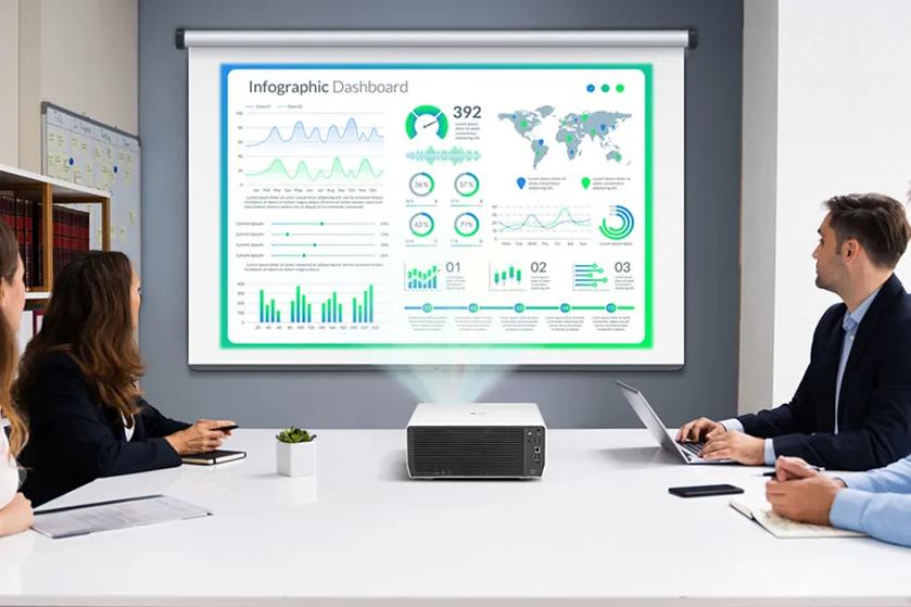 People in a conference room viewing an infographic projected on a screen.
