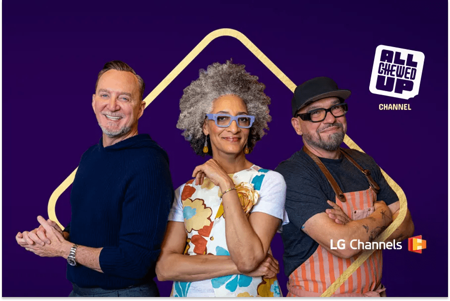 Clinton Kelly, Carla Hall and Michael Symon stand smiling together against a purple background with a gold frame, promoting the All Chewed Up channel on LG Channels.