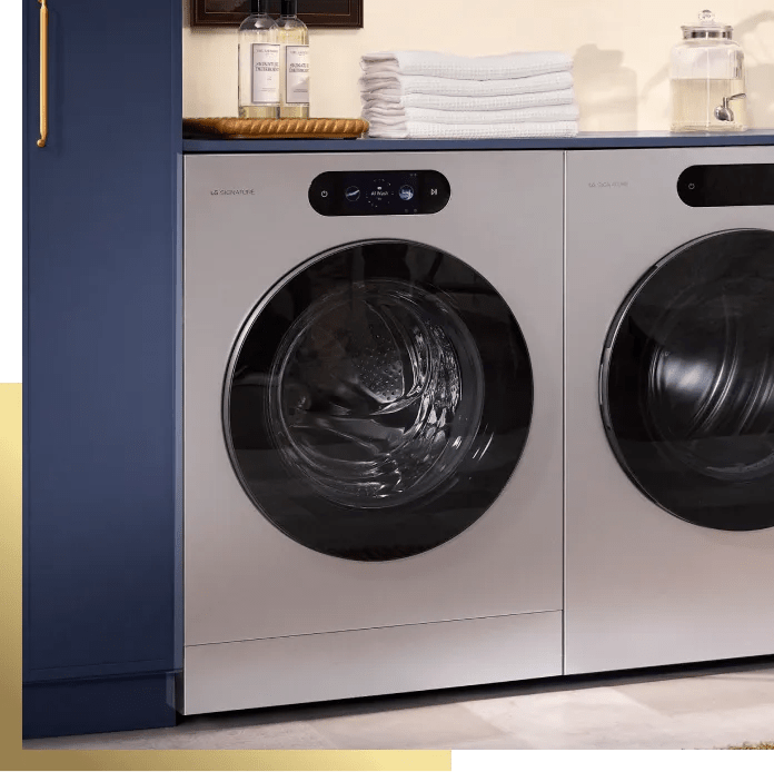 LG SIGNATURE washer and dryer pair with AI-powered wash cycles displayed on digital control panels, front view.
