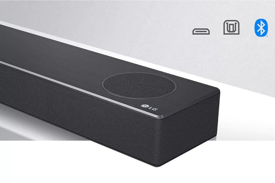Close-up LG Soundbar right side with LG logo on the bottom right corner. Connectivity icons shown above the product.