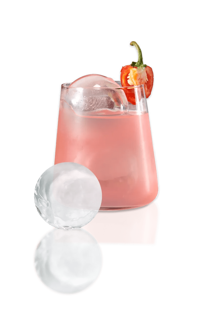 Brown soda in a clear glass with craft ice and a striped straw.