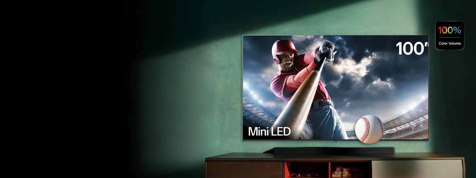 A QNED TV displays a vivid scene is a living room setting. “Official TV patner of Emmy® season” badge.