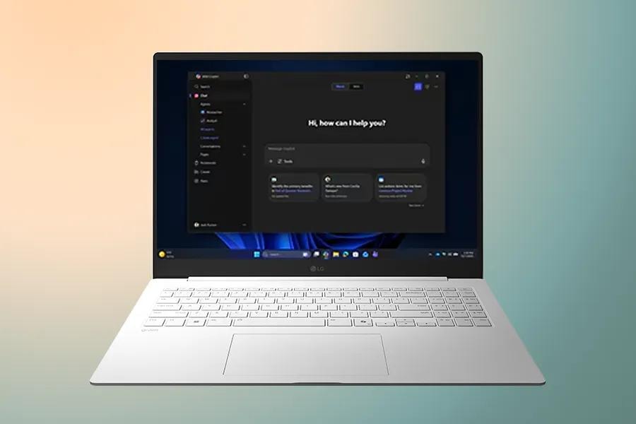 A laptop displaying a clear Windows 11 screen on a gradient background.