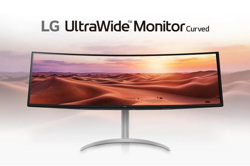 LG UltraWide Curved Monitor displaying a sunset desert landscape.