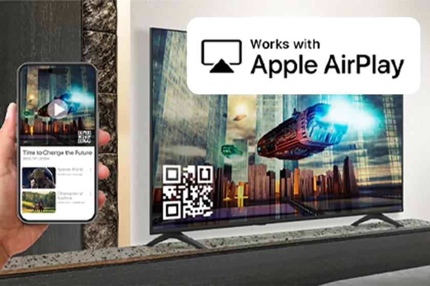 A guest watches TV on an UJ661H Hotel TV using Apple Airplay from their smartphone