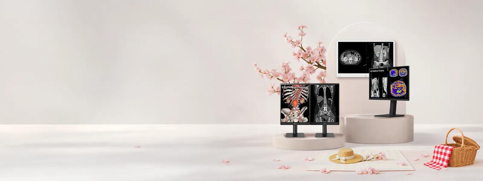 Minimalist picnic scene featuring warm beige pedestals with LG on them