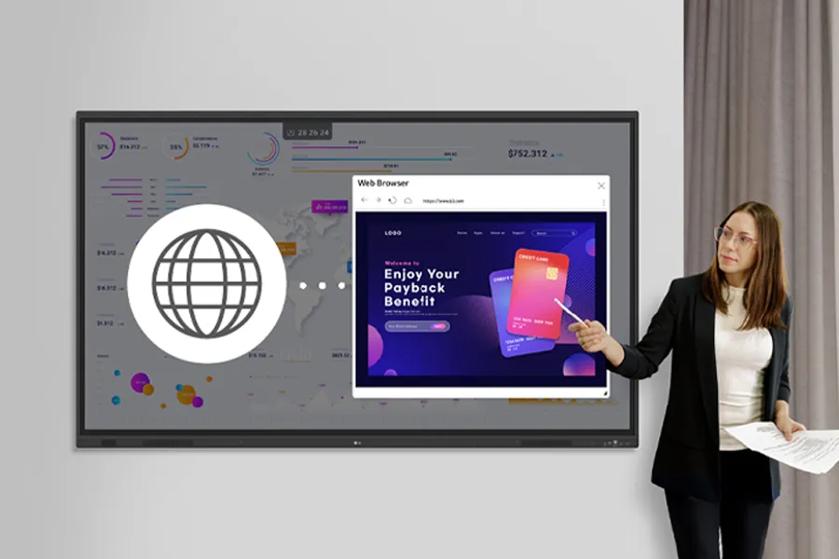 A woman points at a screen displaying a web browser window over a data dashboard.