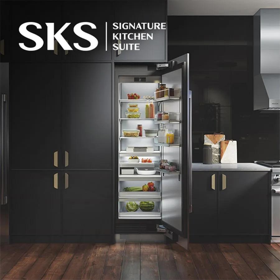 SKS Signature Kitchen Suite - luxury kitchen with an open door refrigerator full of food. 