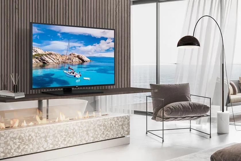 Hotel room with an LG TV displaying a vibrant, colorful beach.