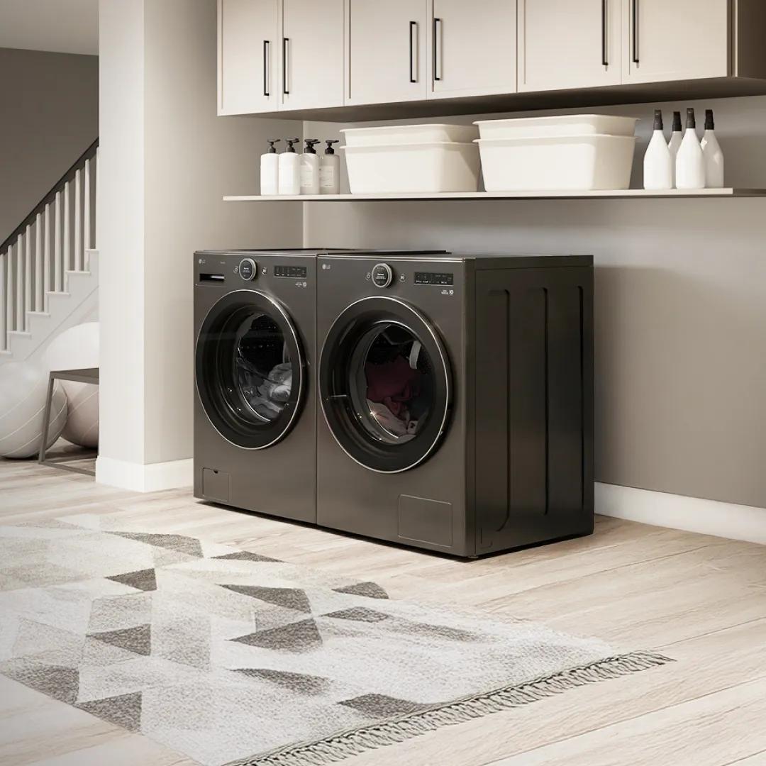 A mother and daughter unload laundry from an LG all-in-one washer and heat pump dryer.