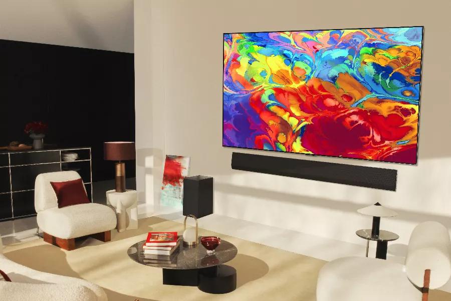 LG OLED TV in living room showing colorful artistic display