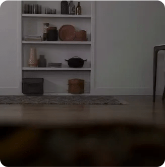 A mage shows a child sliding into frame and knocking on the oven window, which lights up to showcase a baking pizza.