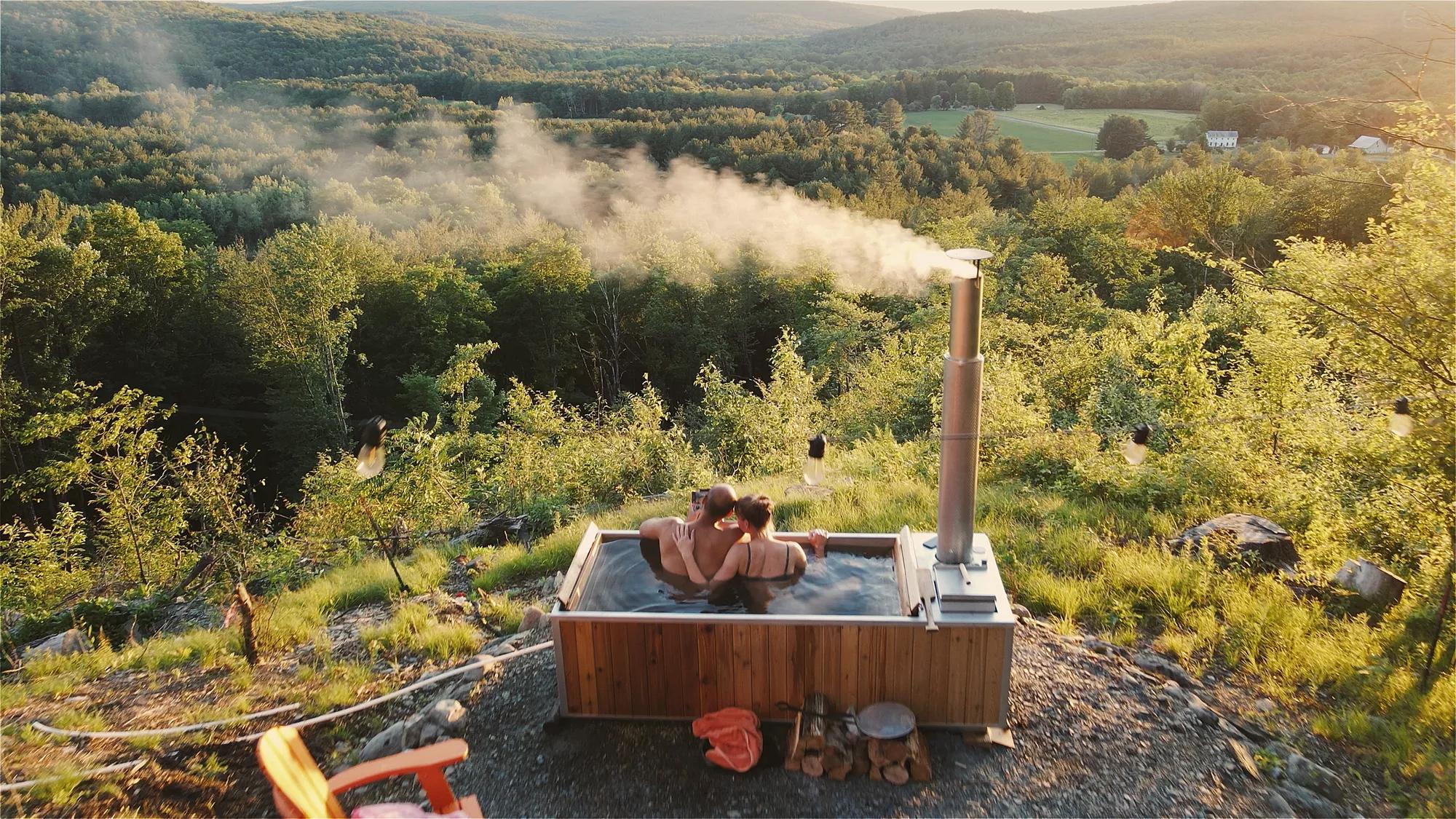 Couple in outdoor hot tub.