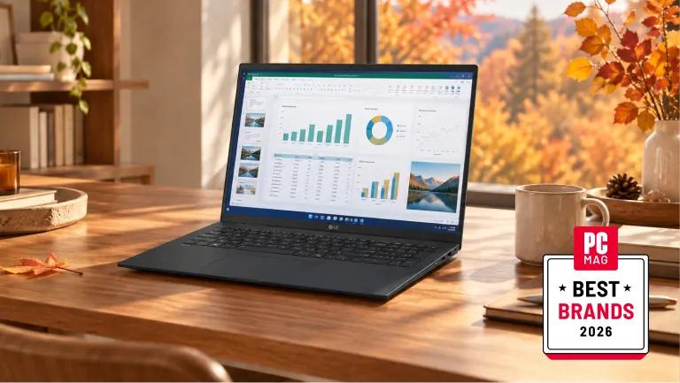 LG gram laptop open on a wooden desk displaying spreadsheet and data charts, with autumn foliage visible through a window, alongside a PC Mag Best Brands 2026 badge.