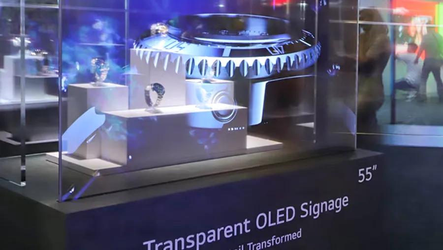 Close-up of LG Transparent OLED used as part of a wristwatch display case, with graphics overlayed on the watches displayed within. 