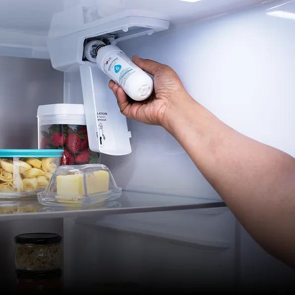 An LG refrigerator water filter is replaced.